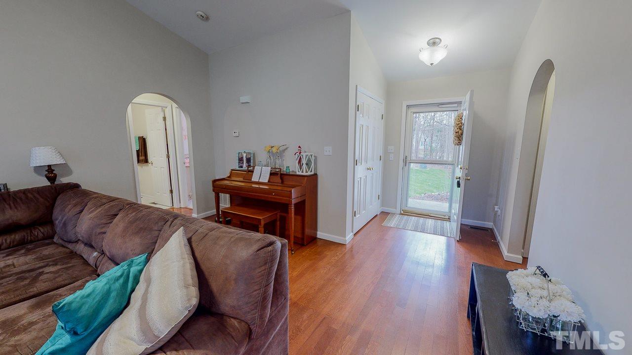 342 Punch Hill Farm Road Rougemont, NC 27572 - Photo 26 of 30 a living room with furniture and a wooden floor
