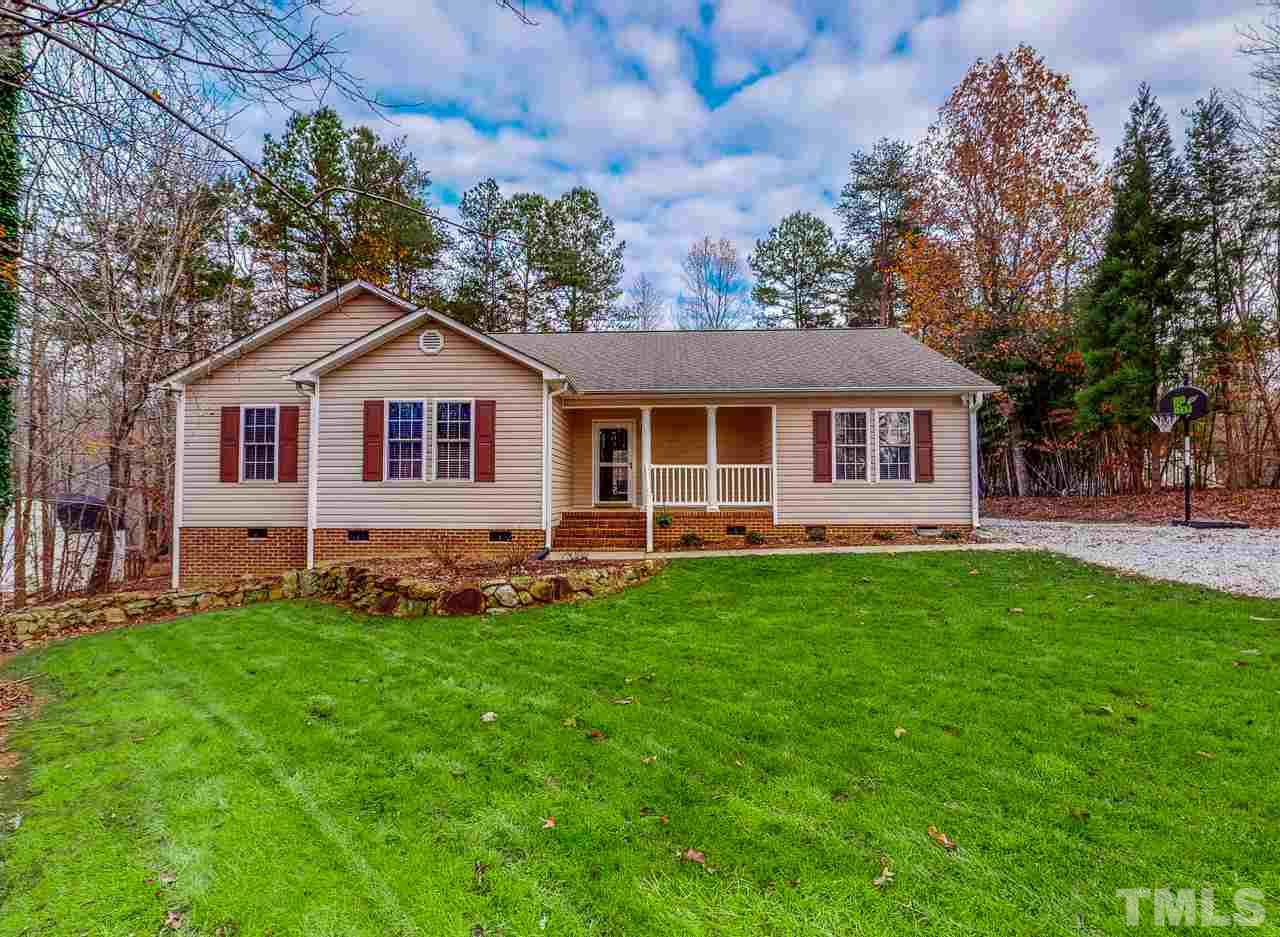 342 Punch Hill Farm Road Rougemont, NC 27572 - Photo 30 of 30 a view of a house with a backyard