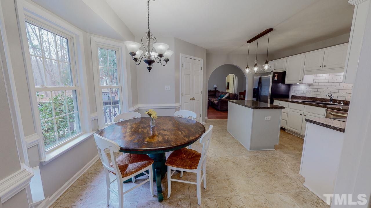 342 Punch Hill Farm Road Rougemont, NC 27572 - Photo 4 of 30 a kitchen with sink refrigerator dining table and chairs