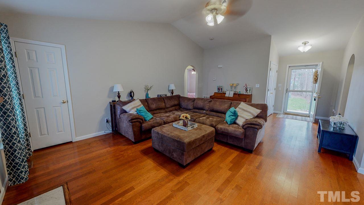 342 Punch Hill Farm Road Rougemont, NC 27572 - Photo 6 of 30 a living room with furniture and a wooden floor
