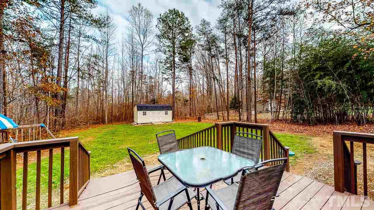 342 Punch Hill Farm Road Rougemont, NC 27572 - Photo 7 of 30 a view of a chairs and table on the wooden floor