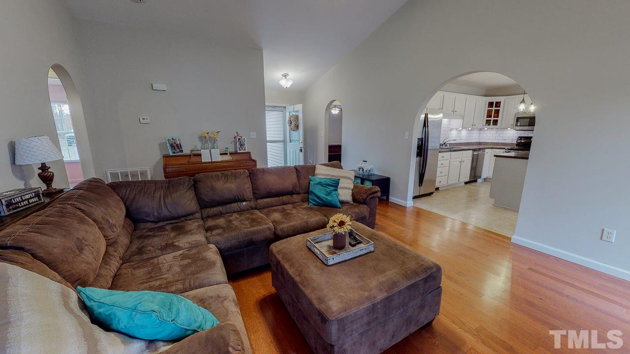 342 Punch Hill Farm Road Rougemont, NC 27572 - Photo 10 of 30 a living room with furniture and a wooden floor