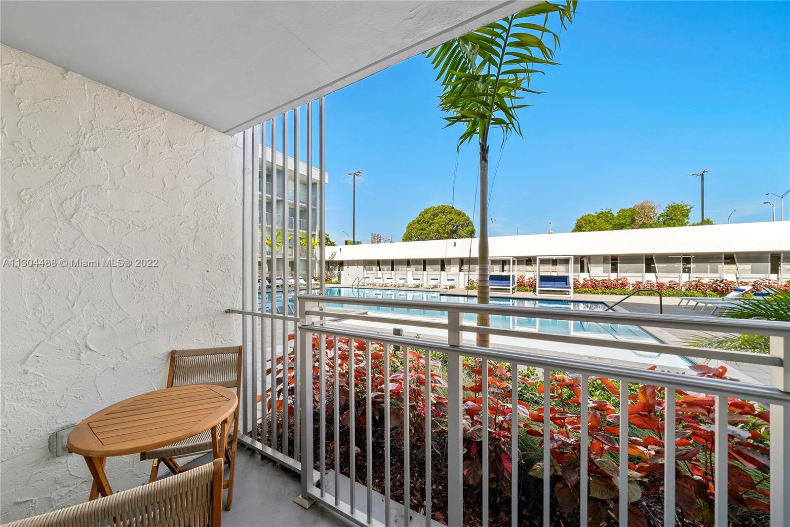 1950 West 49th Street, Unit 213 Hialeah, FL 33012 - Photo 11 of 49 a view of a porch with chairs
