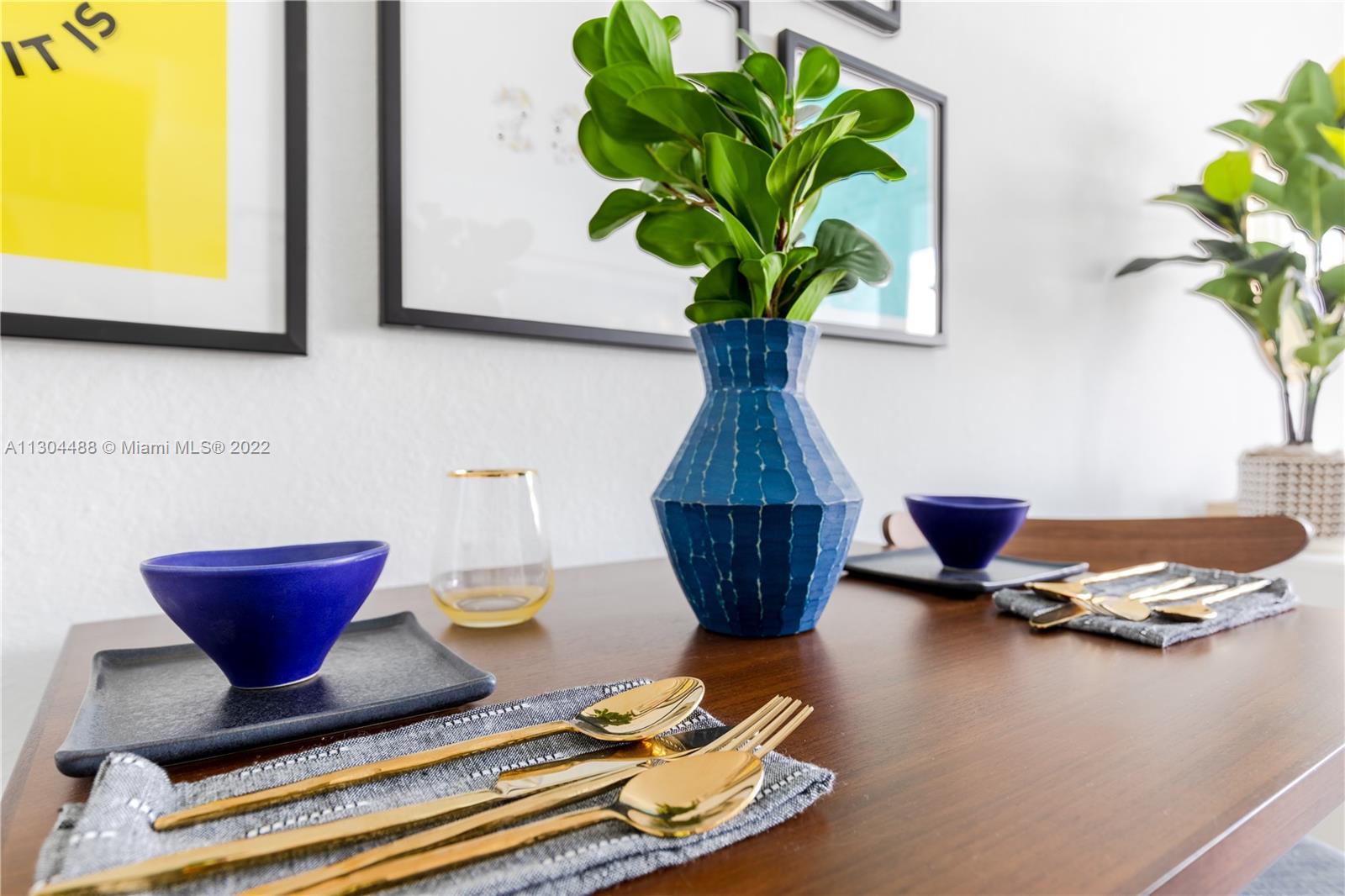 1950 West 49th Street, Unit 213 Hialeah, FL 33012 - Photo 13 of 49 a vase of flowers sitting on a table
