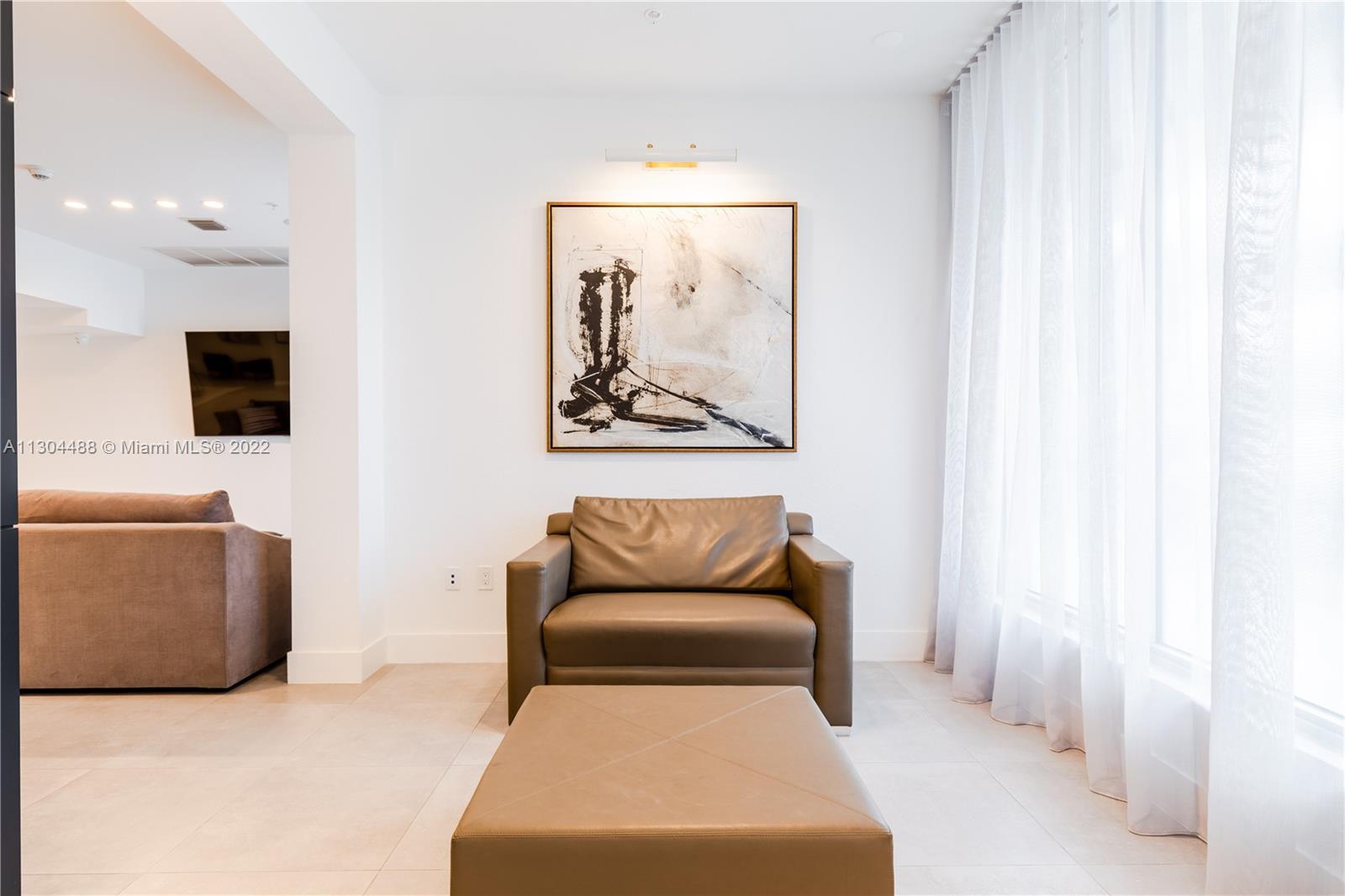 1950 West 49th Street, Unit 213 Hialeah, FL 33012 - Photo 23 of 49 a bedroom with a bed and couch