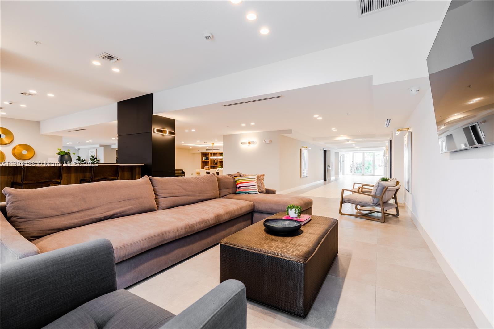 1950 West 49th Street, Unit 213 Hialeah, FL 33012 - Photo 31 of 49 a living room with furniture and a table