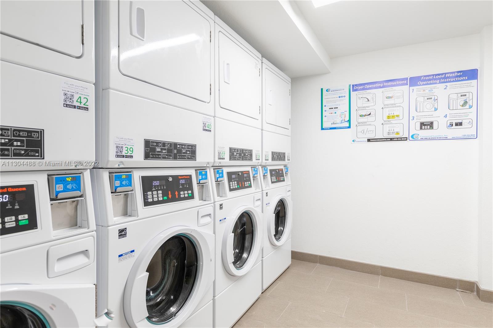 1950 West 49th Street, Unit 213 Hialeah, FL 33012 - Photo 39 of 49 a utility room with dryer and washer