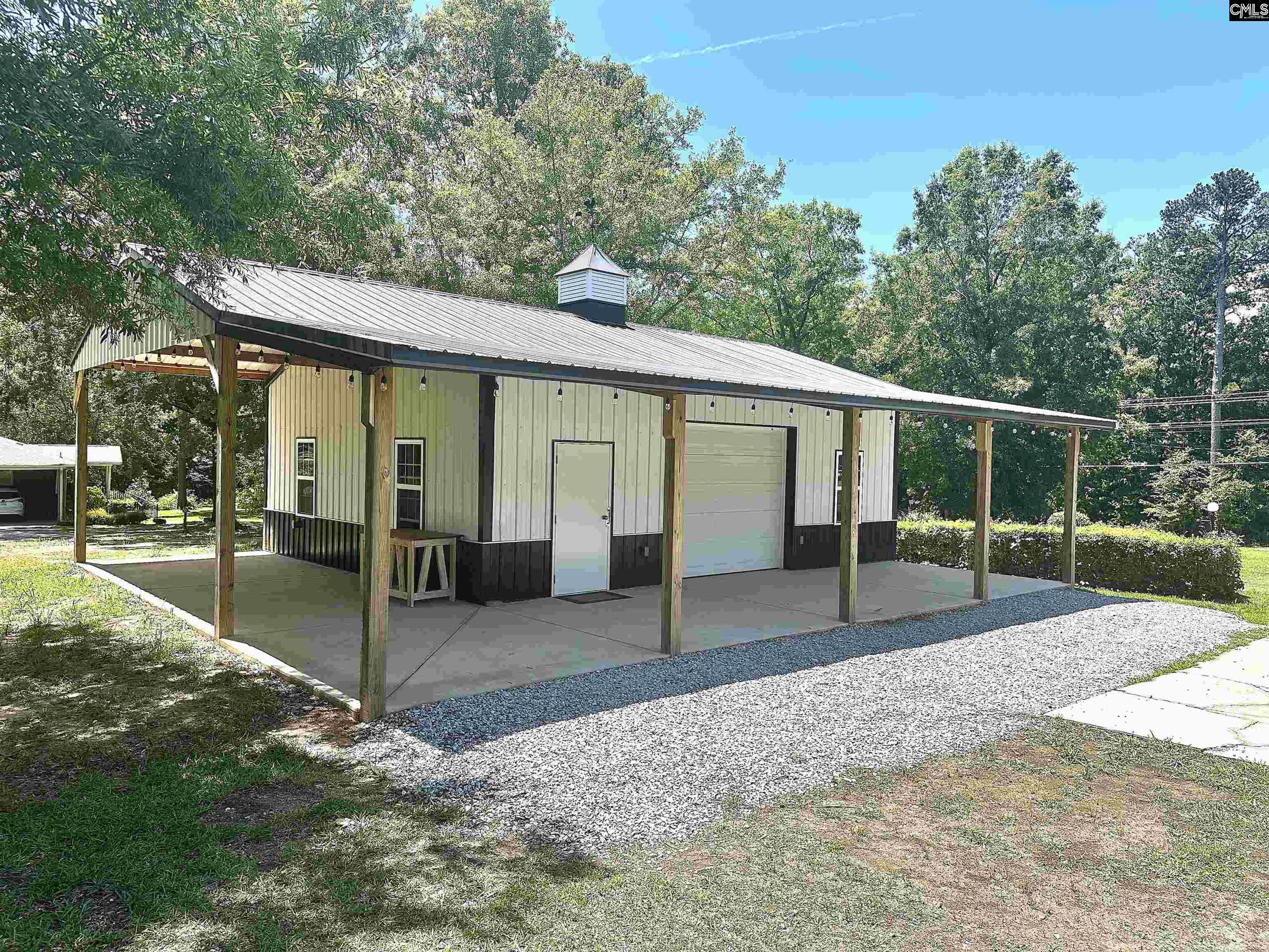 535 Sandbar Road Chapin, SC 29036 - Photo 6 of 23 a view of a house with backyard and a patio