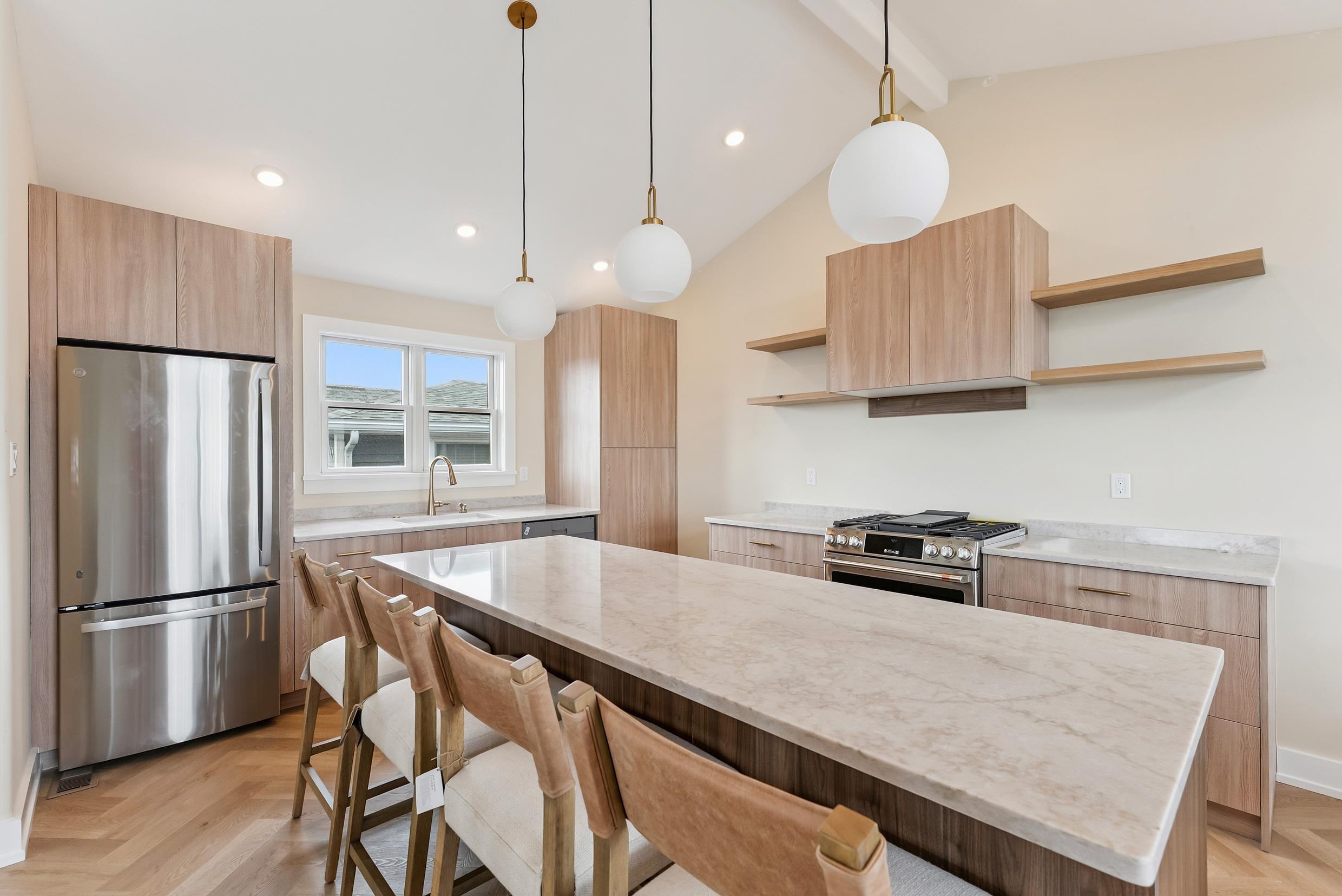 4301 Central, Unit NORTH Sea Isle City, NJ 08243 - Photo 20 of 47 a kitchen with stainless steel appliances granite countertop a stove a refrigerator a kitchen island a sink and a refrigerator