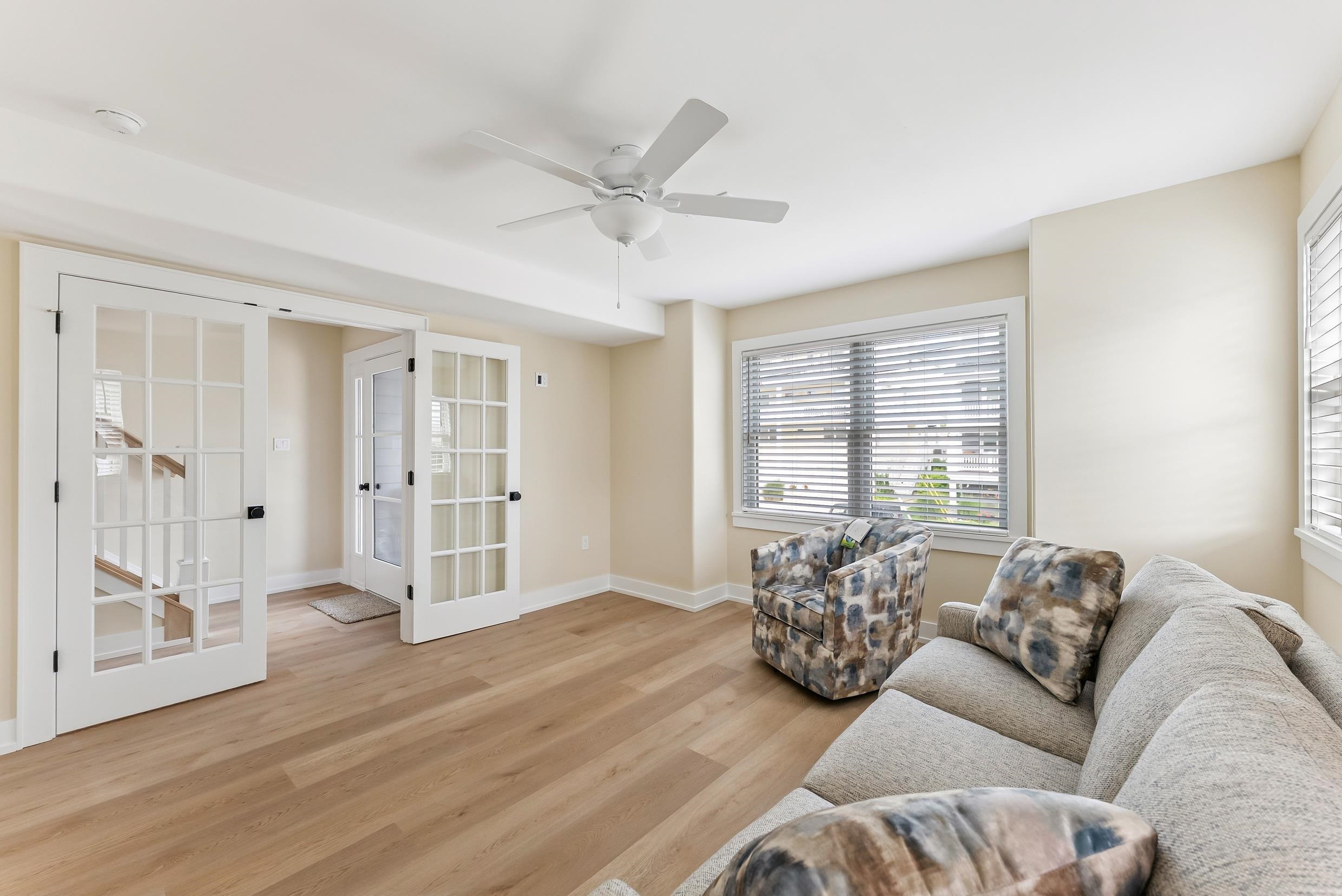4301 Central, Unit NORTH Sea Isle City, NJ 08243 - Photo 27 of 47 a living room with furniture and a large window