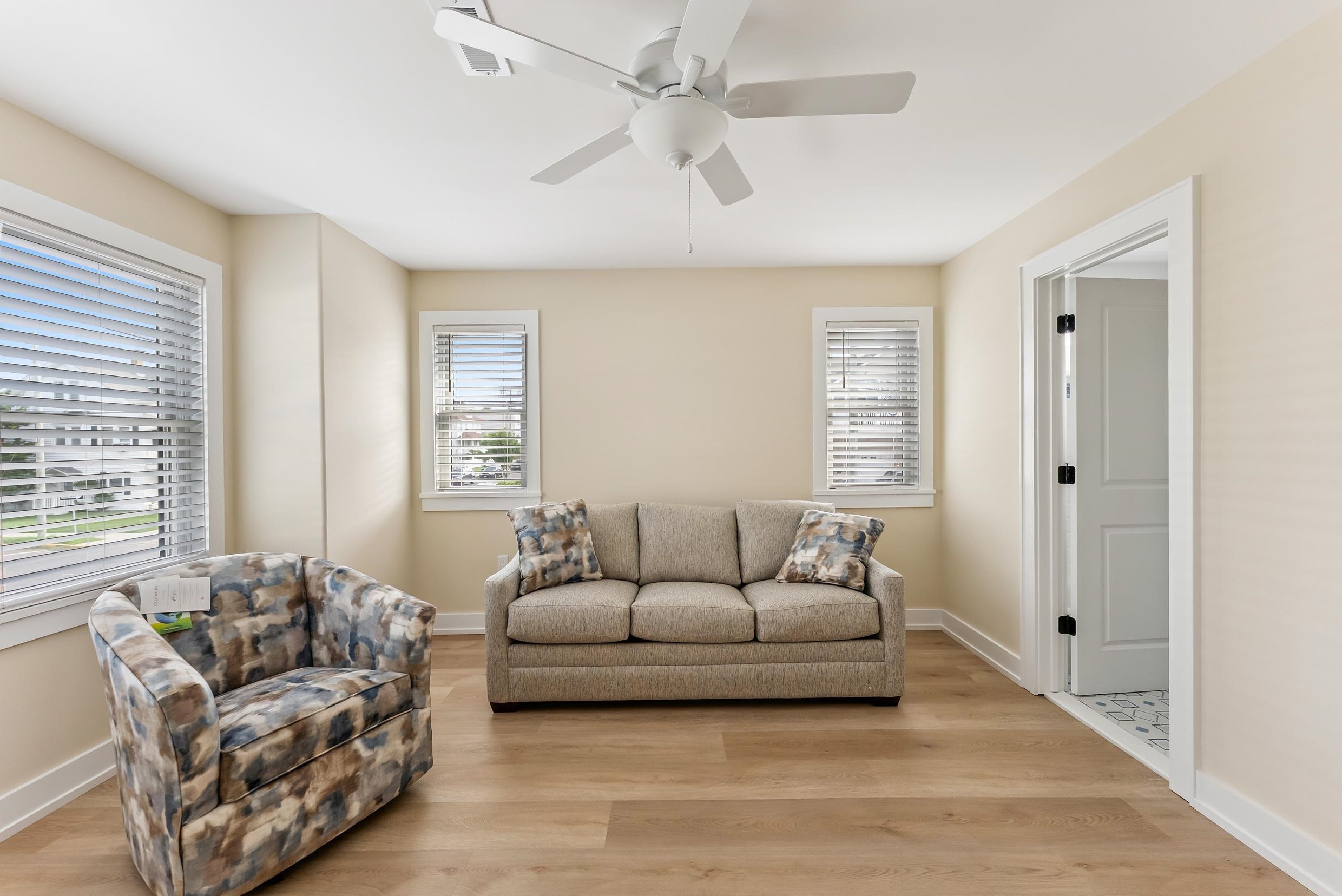 4301 Central, Unit NORTH Sea Isle City, NJ 08243 - Photo 28 of 47 a living room with furniture and a large window