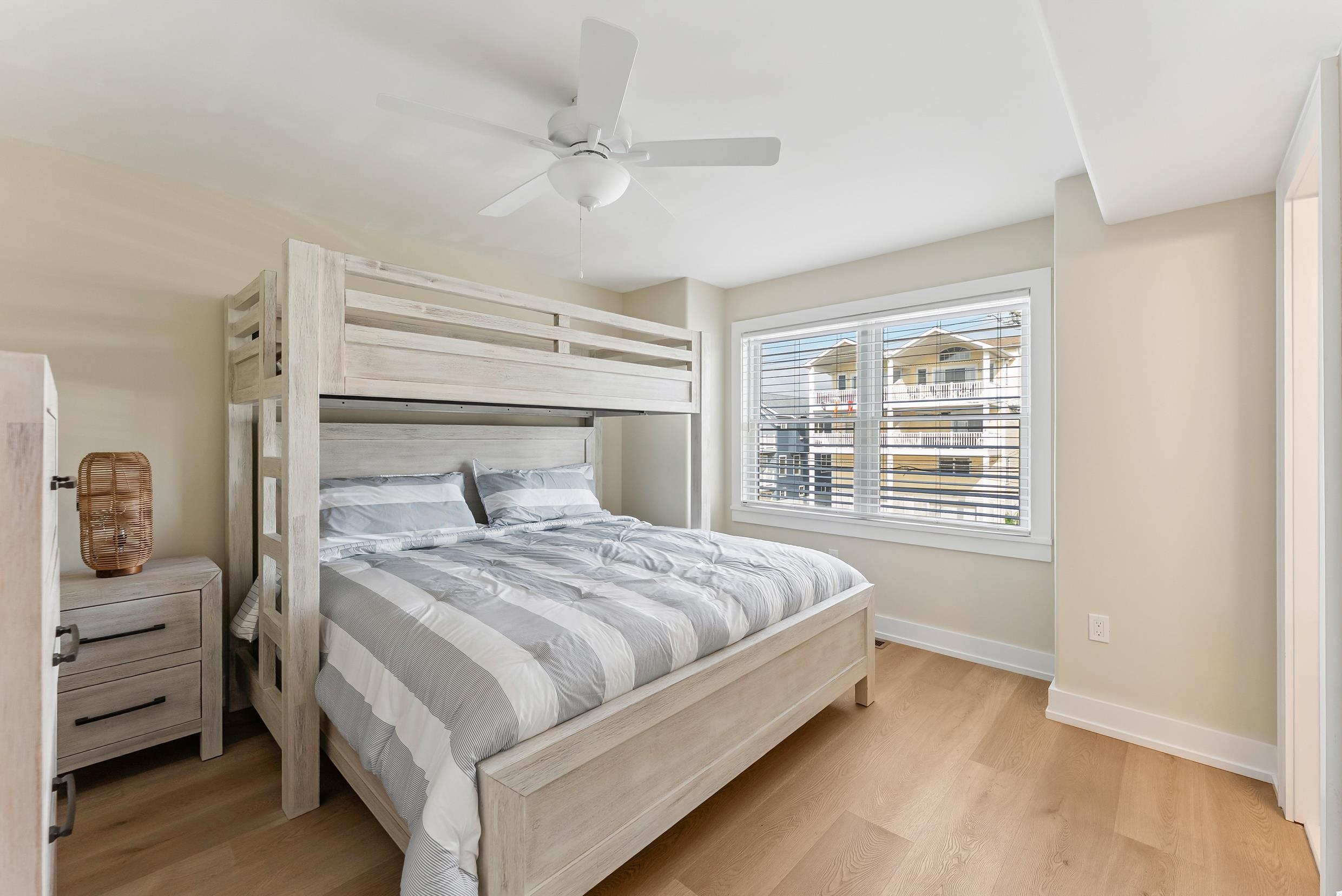 4301 Central, Unit NORTH Sea Isle City, NJ 08243 - Photo 31 of 47 a bedroom with a bed and a window