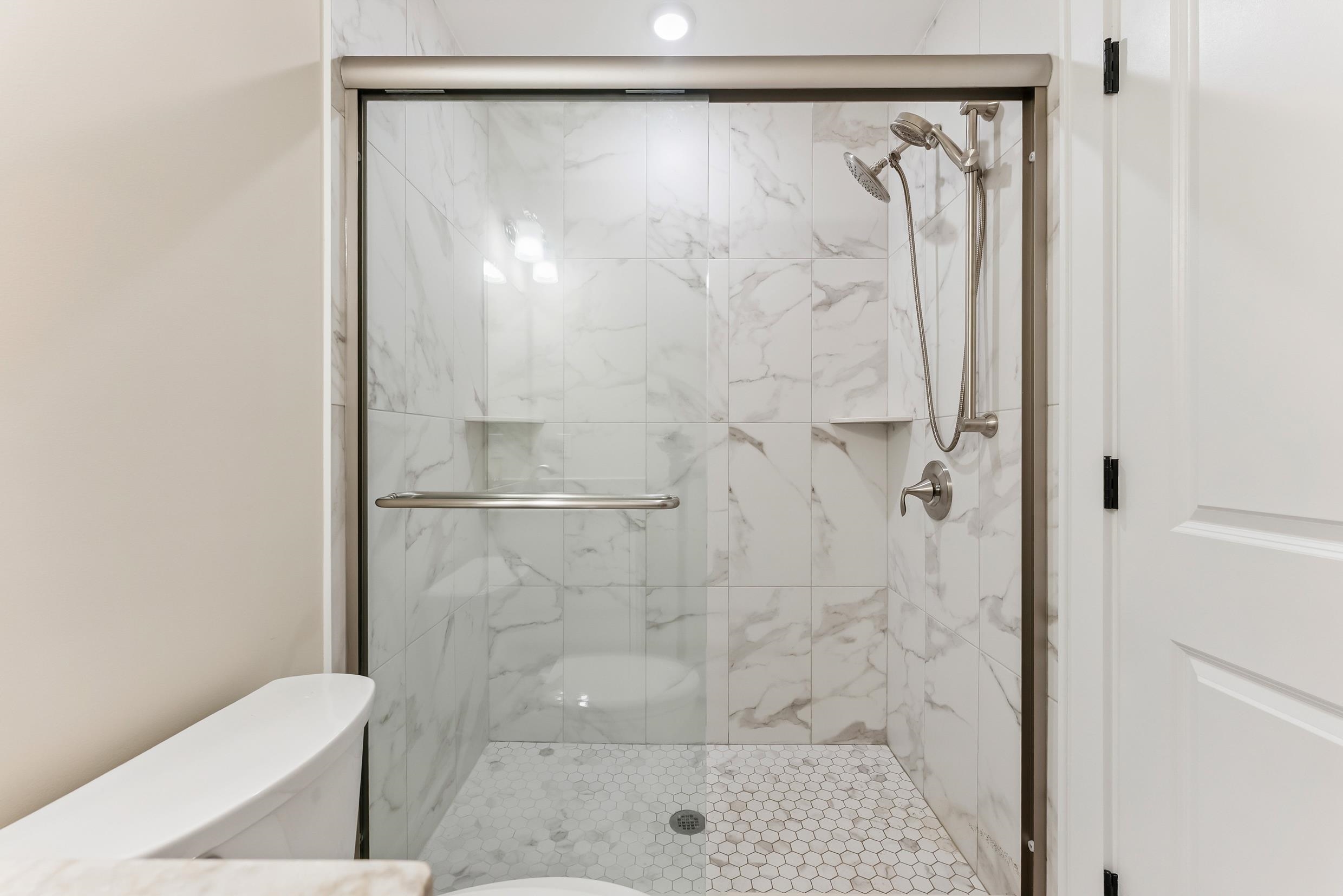 4301 Central, Unit NORTH Sea Isle City, NJ 08243 - Photo 35 of 47 a bathroom with a shower and toilet