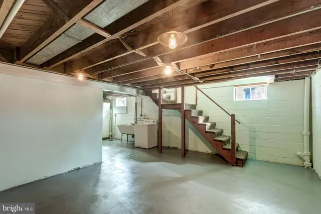 a view of an empty room with stairs