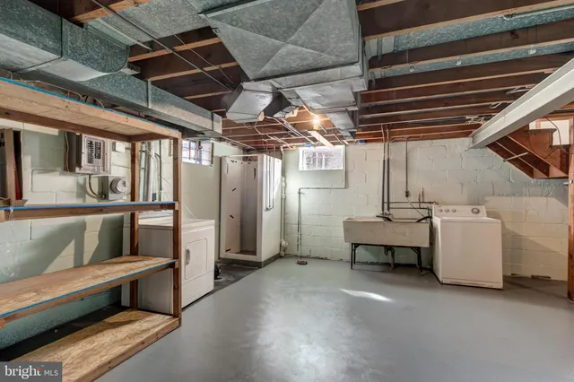 a view of a couch in wooden floor