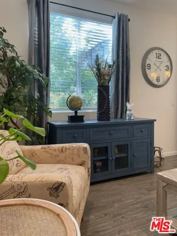 a living room with a large window and table