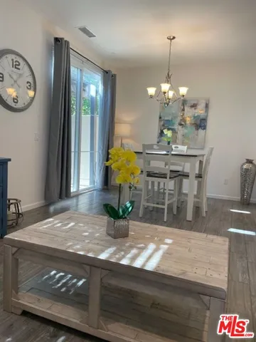 a view of dining table furniture and chandelier