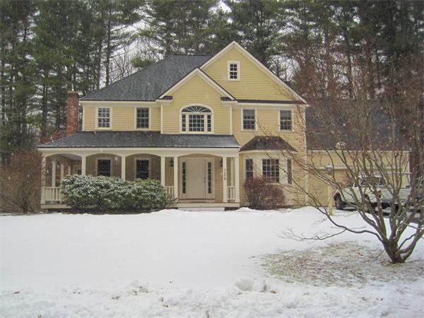 728 Burroughs Road Boxborough, MA 01719 - Photo 1 of 21 a front view of a house with a yard covered in snow
