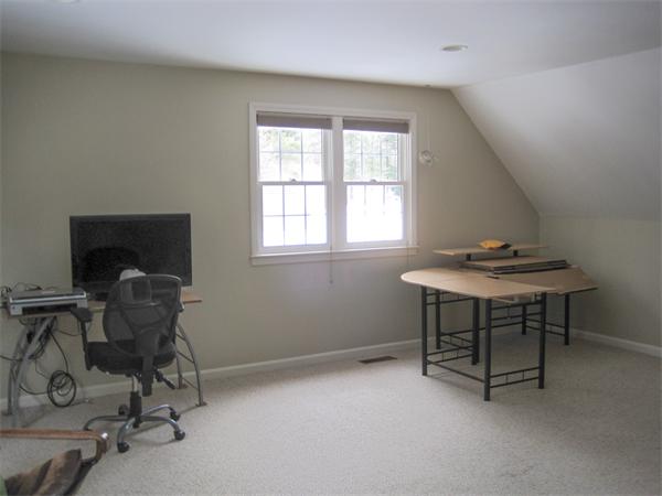 728 Burroughs Road Boxborough, MA 01719 - Photo 18 of 21 a view of a workspace with furniture and a window