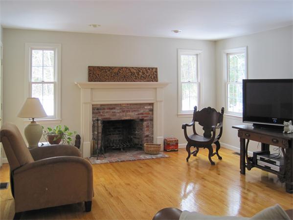 728 Burroughs Road Boxborough, MA 01719 - Photo 7 of 21 a living room with furniture and a fireplace