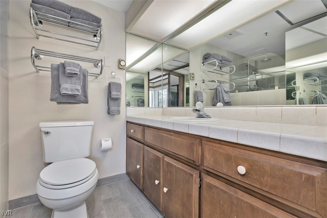333 Ski Way, Unit 277 Incline Village, NV 89451 - Photo 15 of 33 a bathroom with a toilet a sink and mirror