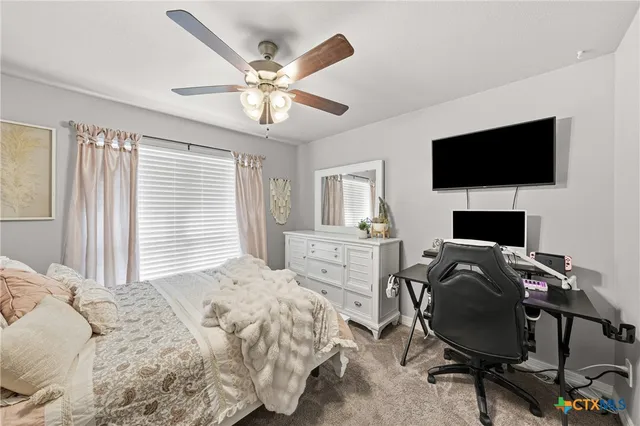 a bedroom with bed and window