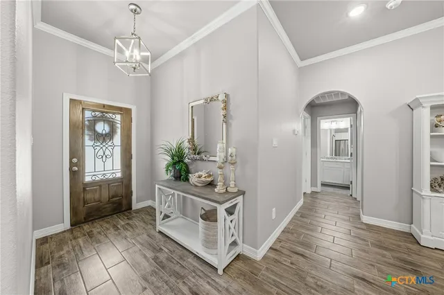 a view of a hallway view with wooden floor and staircase
