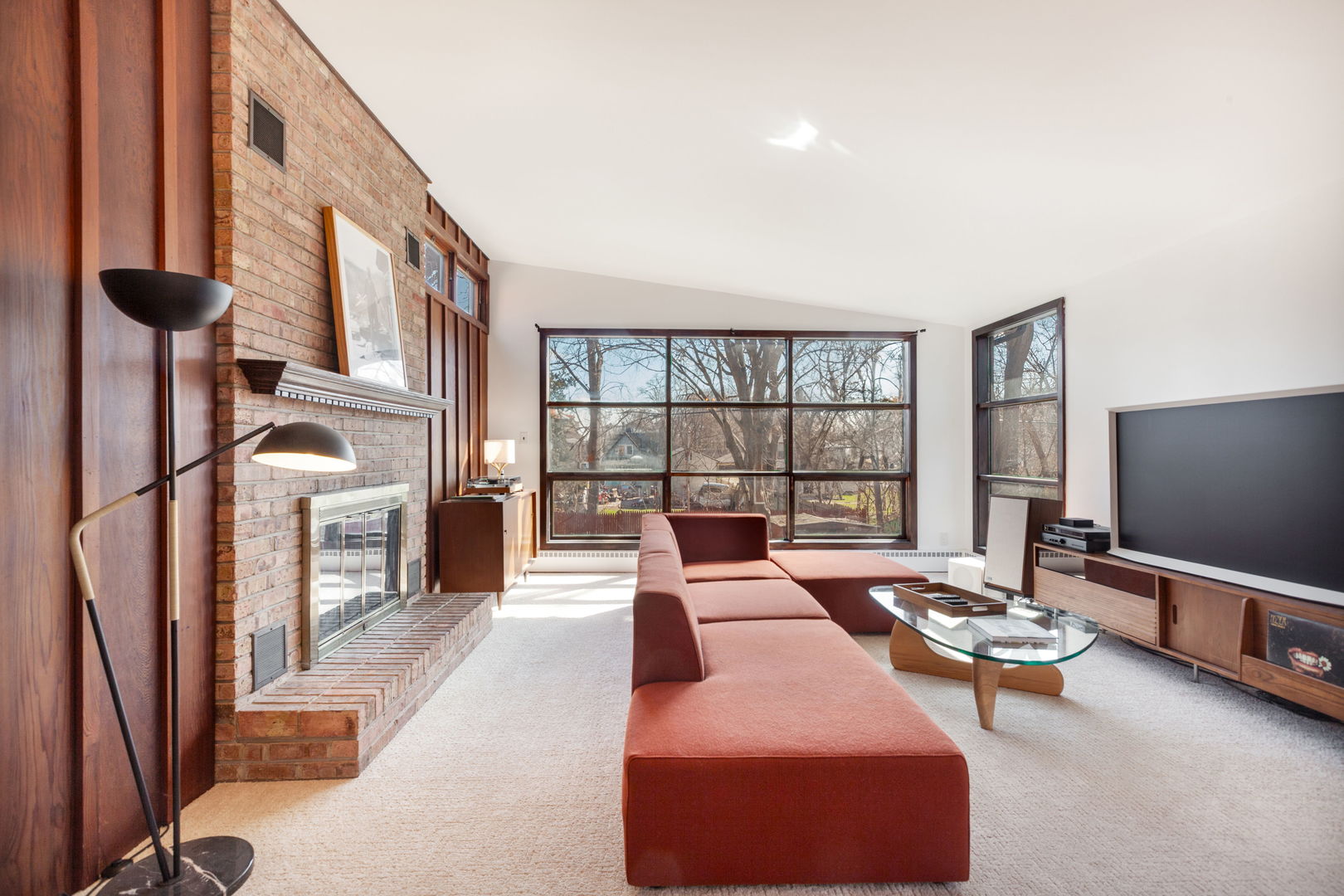 51 Wilcox Avenue Elgin, IL 60123 - Photo 3 of 20 a living room with furniture fireplace and a flat screen tv
