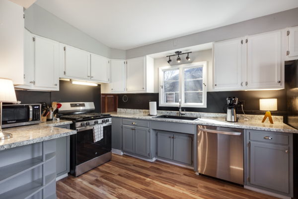 51 Wilcox Avenue Elgin, IL 60123 - Photo 6 of 20 a kitchen with a sink stove top oven and microwave