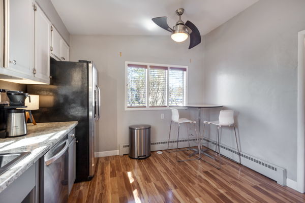51 Wilcox Avenue Elgin, IL 60123 - Photo 8 of 20 a kitchen with cabinets and wooden floor