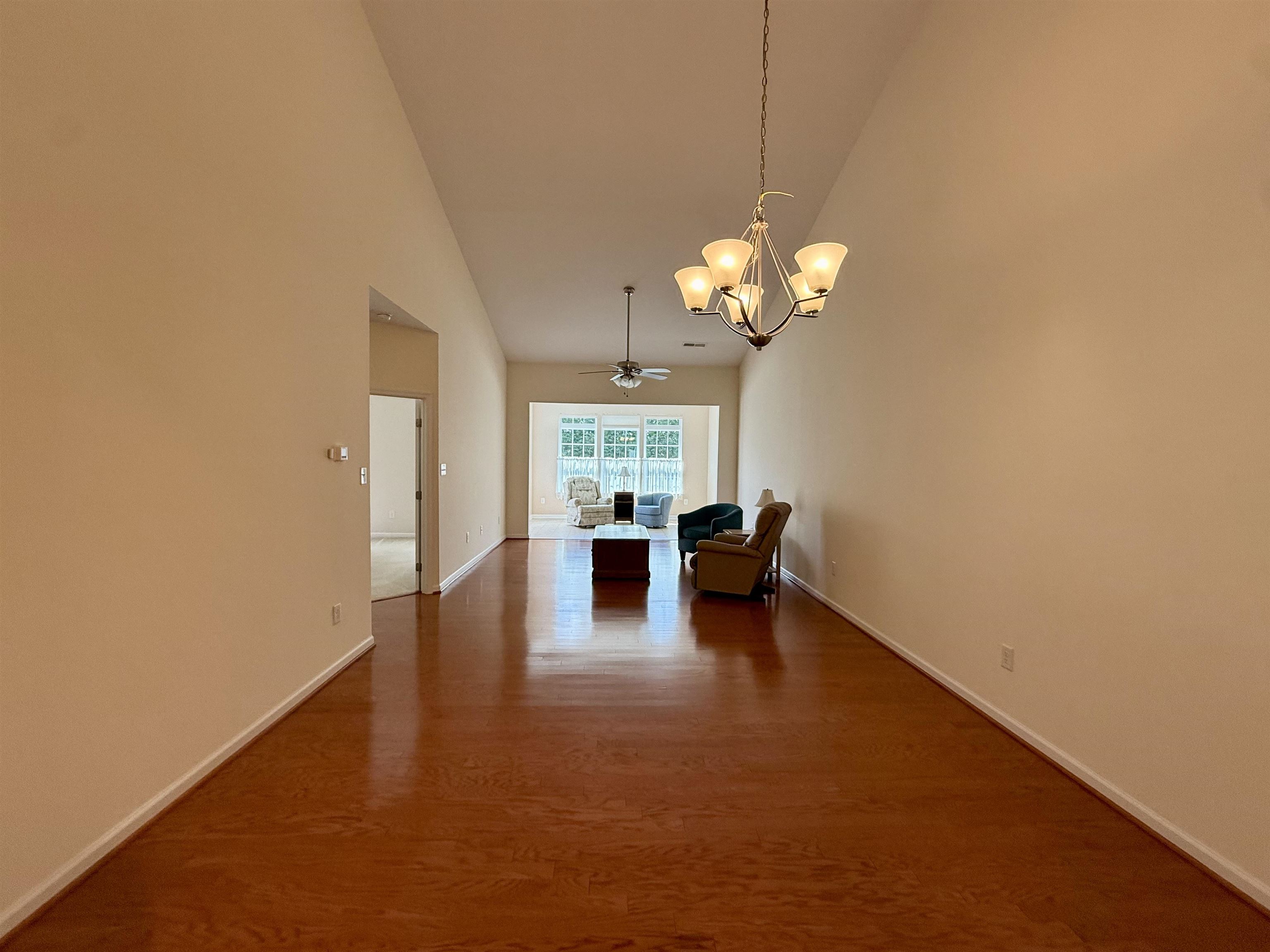 1607 Tidewater Avenue, Unit 1607 Rio Grande, NJ 08242 - Photo 13 of 42 a view of a livingroom with a chandelier furniture and windows