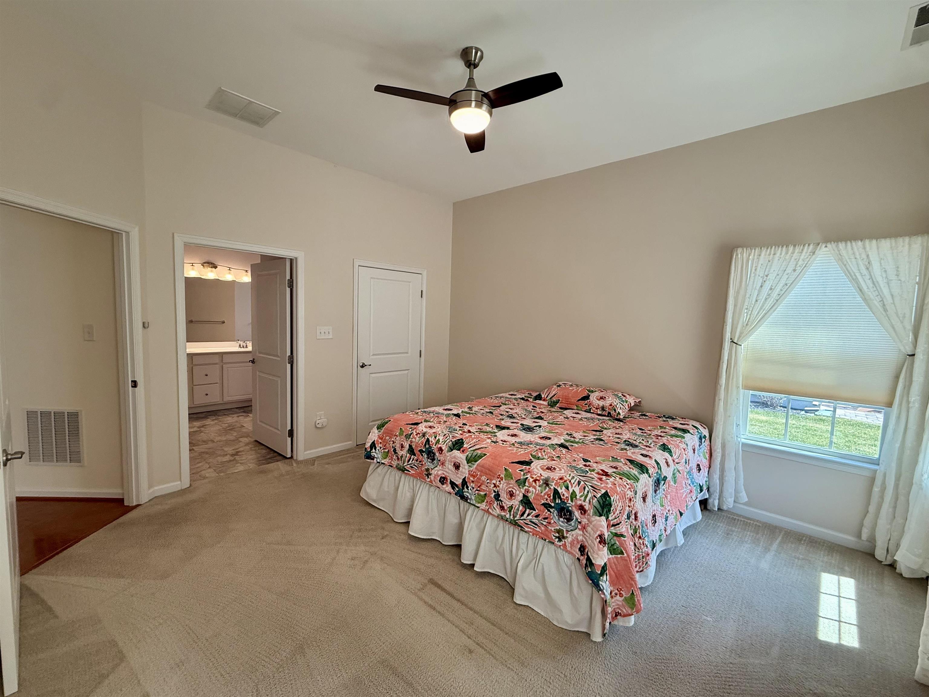 1607 Tidewater Avenue, Unit 1607 Rio Grande, NJ 08242 - Photo 19 of 42 a bedroom with a bed and a ceiling fan