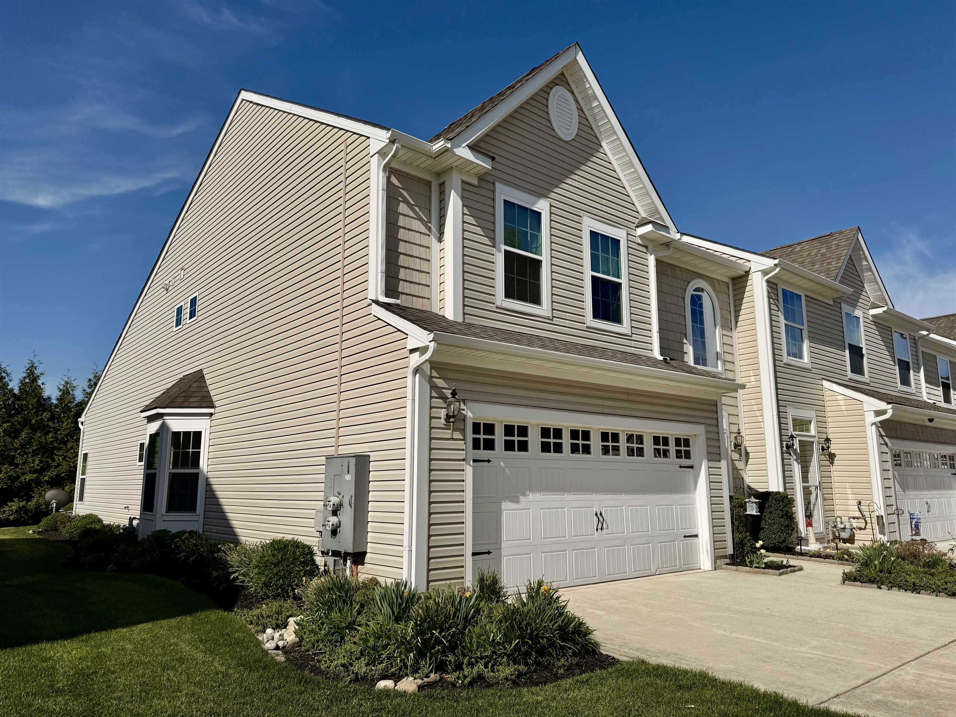1607 Tidewater Avenue, Unit 1607 Rio Grande, NJ 08242 - Photo 2 of 42 a front view of a house with a garden
