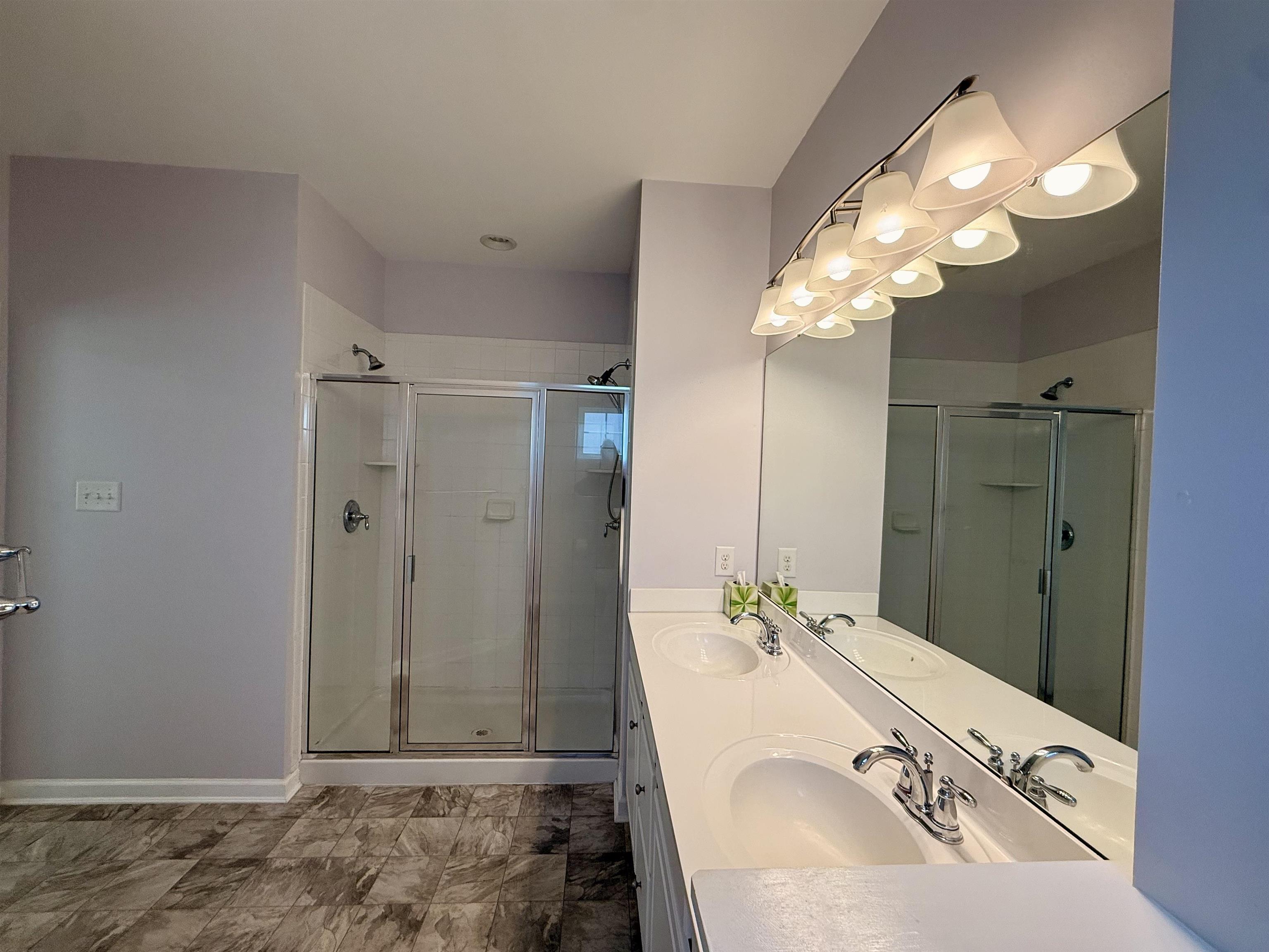 1607 Tidewater Avenue, Unit 1607 Rio Grande, NJ 08242 - Photo 21 of 42 a bathroom with a sink and a mirror