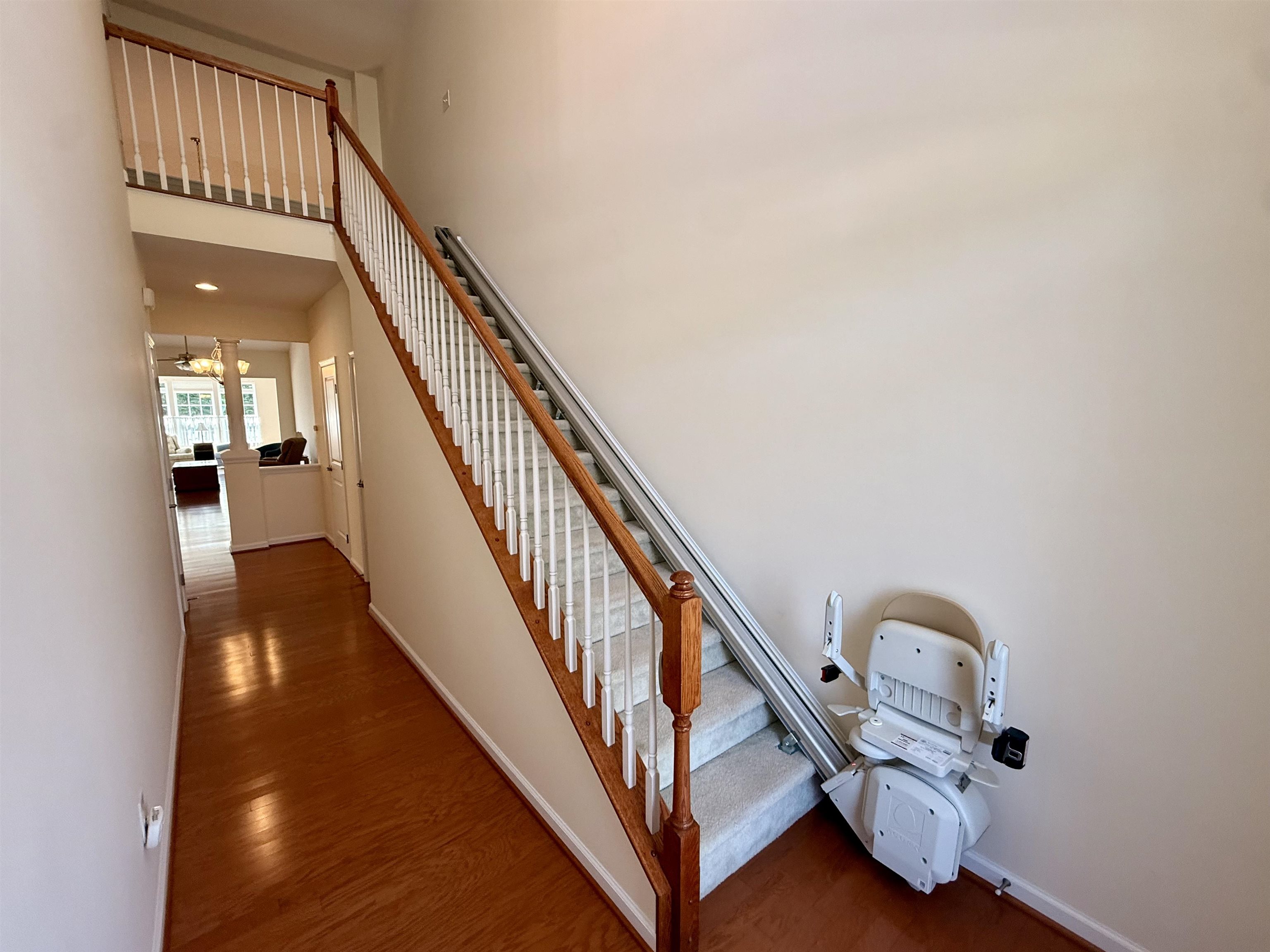 1607 Tidewater Avenue, Unit 1607 Rio Grande, NJ 08242 - Photo 24 of 42 a view of staircase with railing and a chandelier