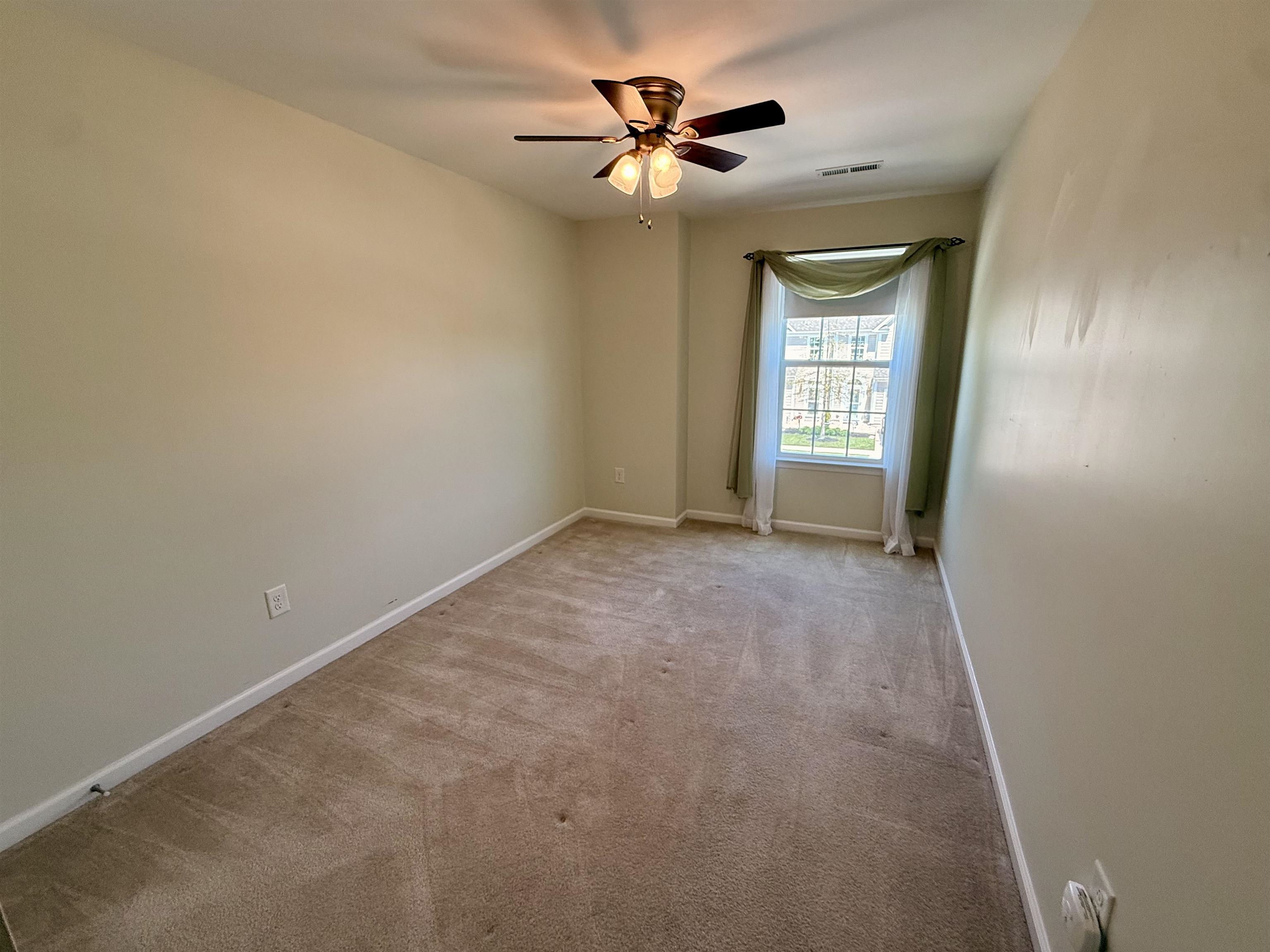 1607 Tidewater Avenue, Unit 1607 Rio Grande, NJ 08242 - Photo 27 of 42 a view of a room with a ceiling fan and a window