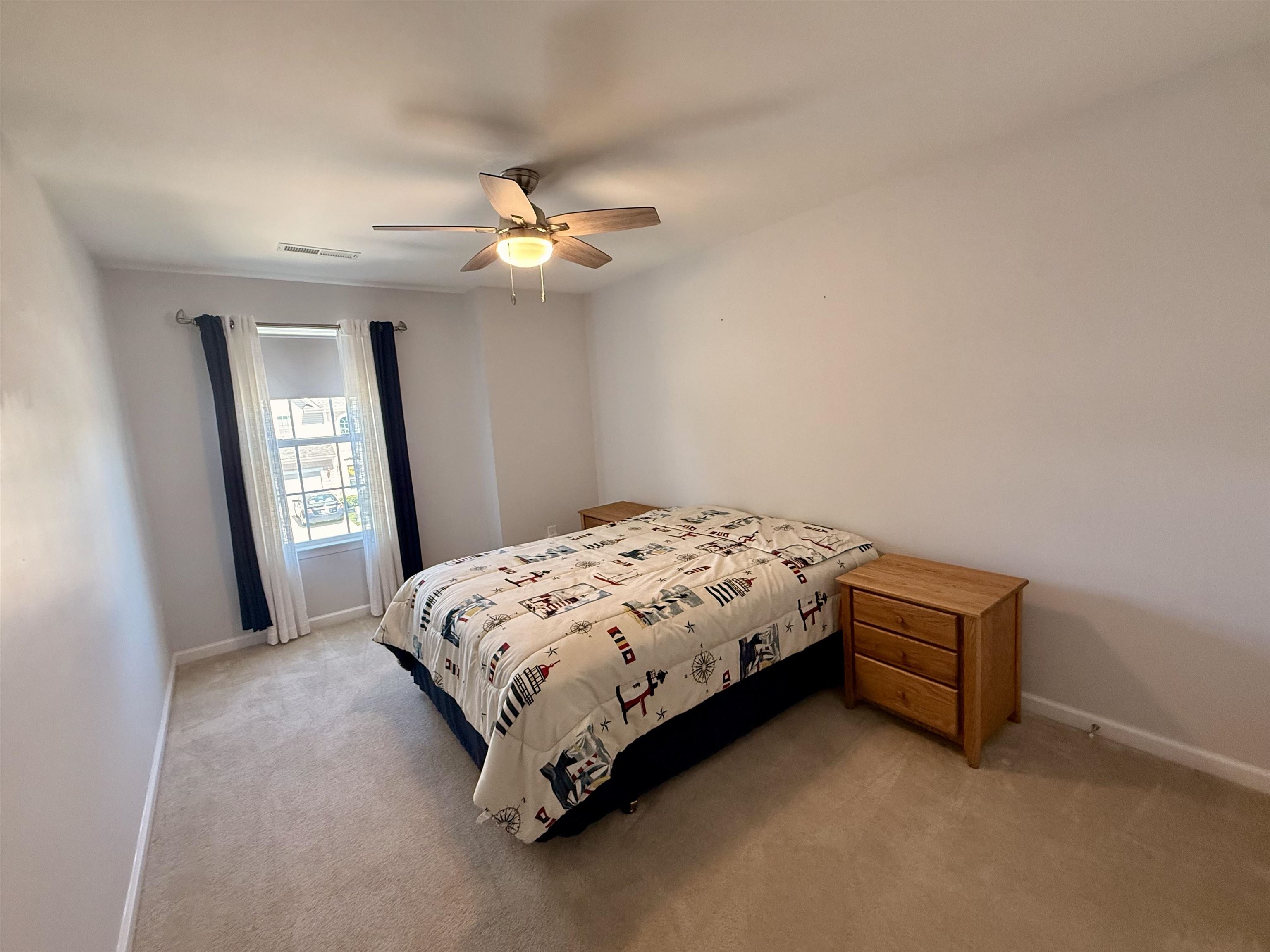 1607 Tidewater Avenue, Unit 1607 Rio Grande, NJ 08242 - Photo 29 of 42 a bedroom with a bed and a window