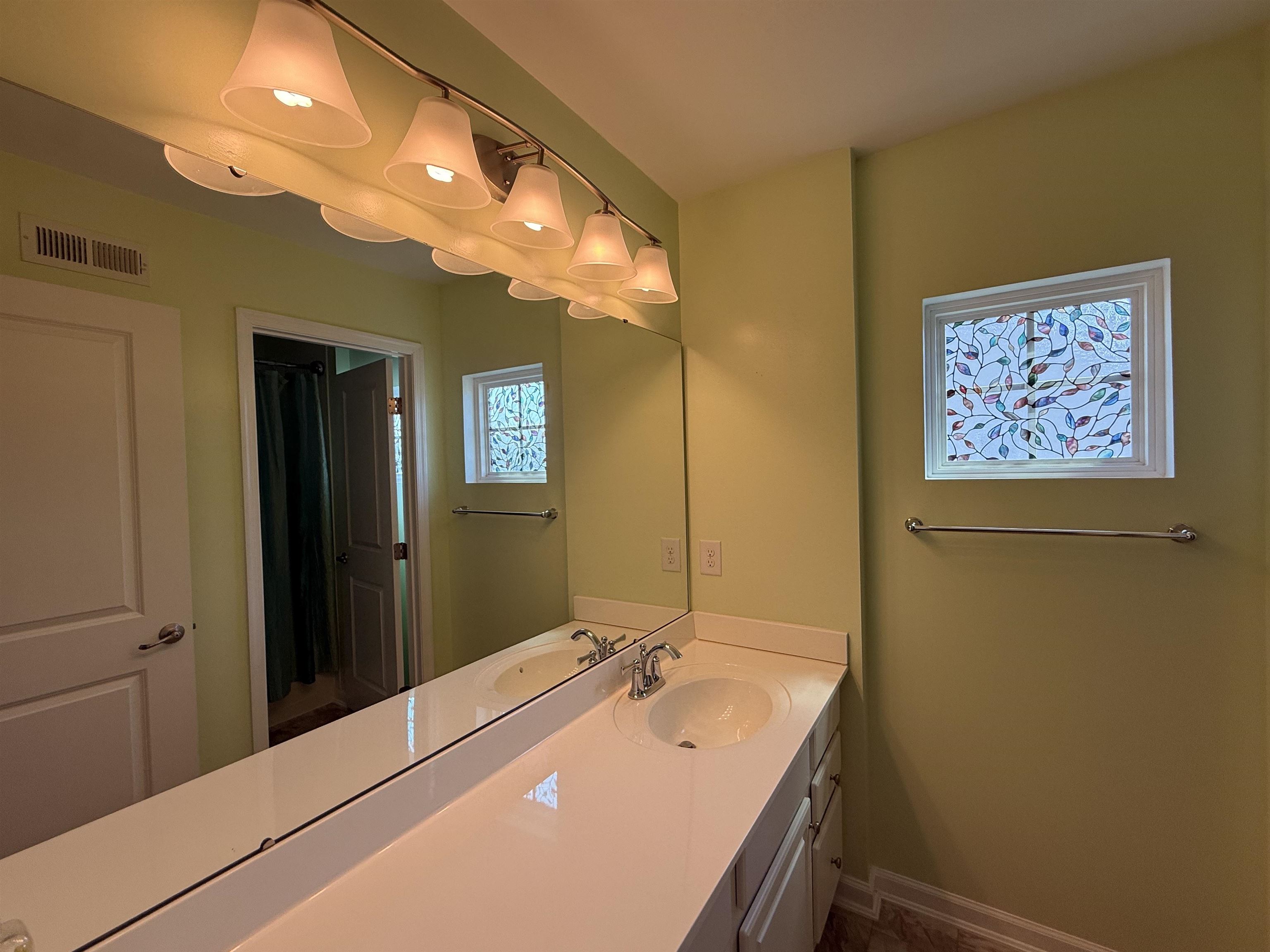 1607 Tidewater Avenue, Unit 1607 Rio Grande, NJ 08242 - Photo 31 of 42 a bathroom with a tub sink and mirror