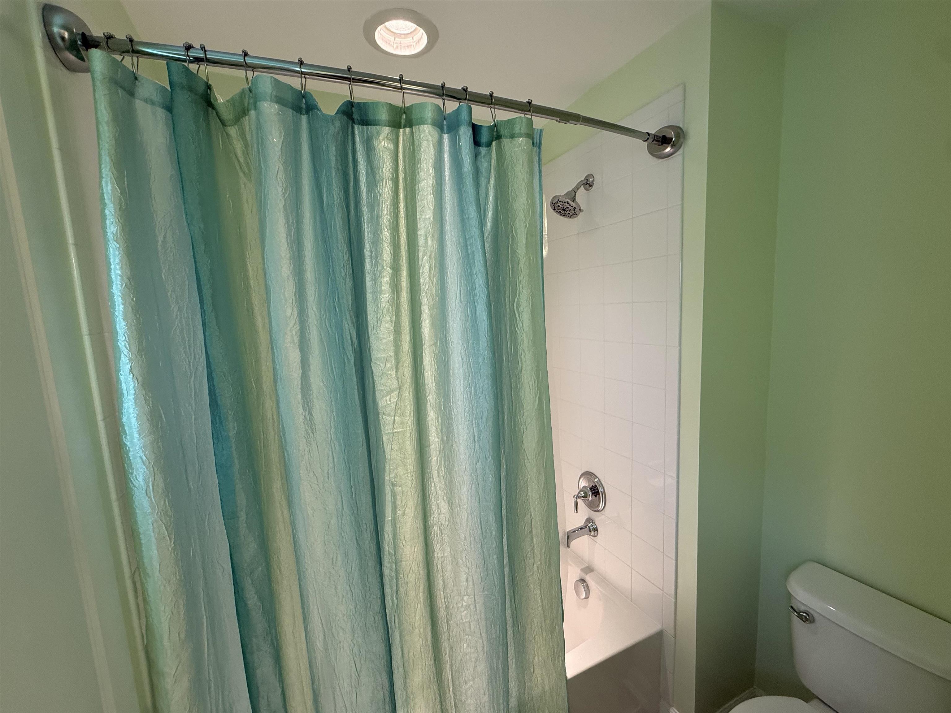 1607 Tidewater Avenue, Unit 1607 Rio Grande, NJ 08242 - Photo 32 of 42 a bathroom with a shower and a toilet
