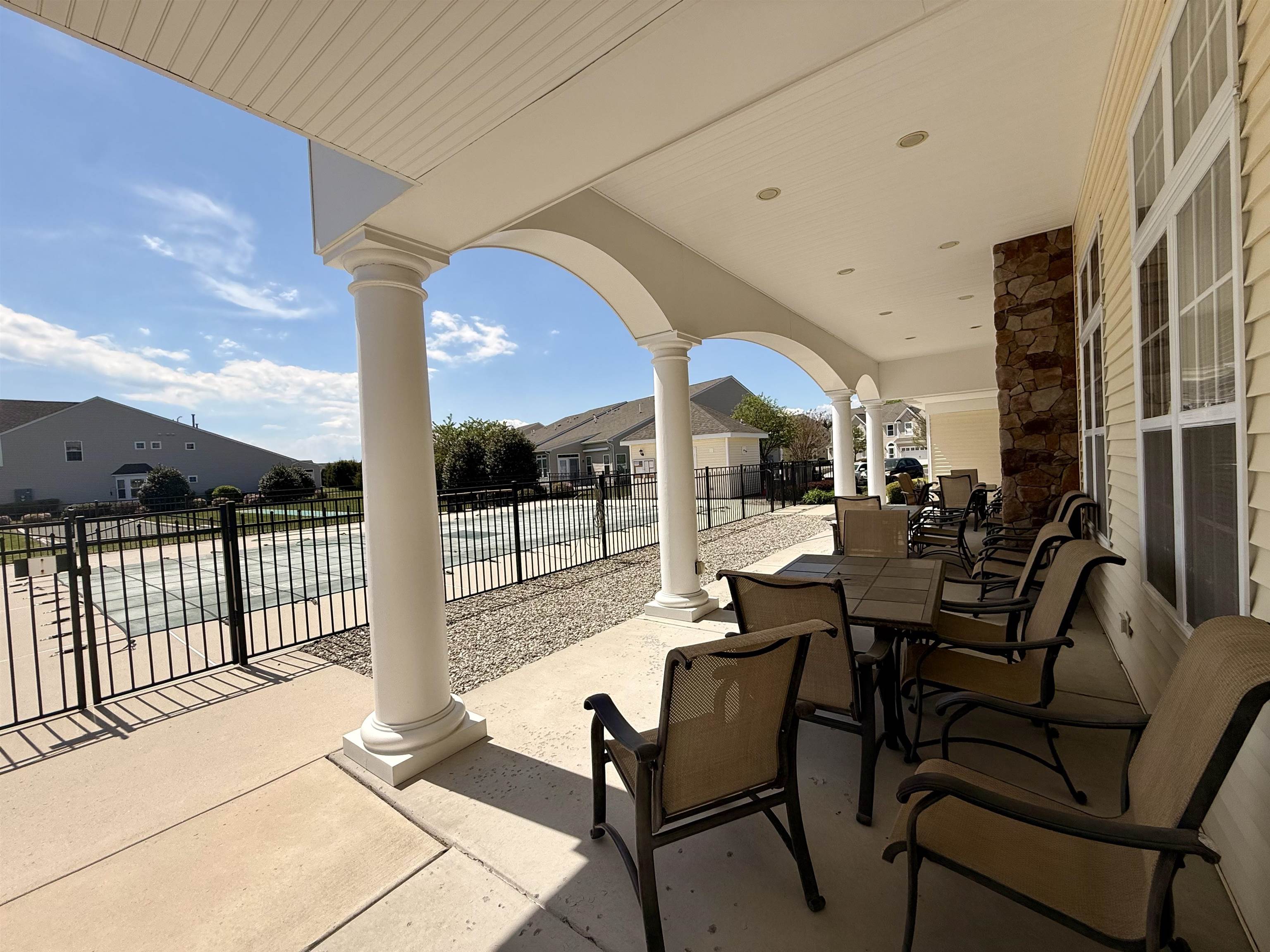 1607 Tidewater Avenue, Unit 1607 Rio Grande, NJ 08242 - Photo 38 of 42 a outdoor space with lots of chairs and chandelier