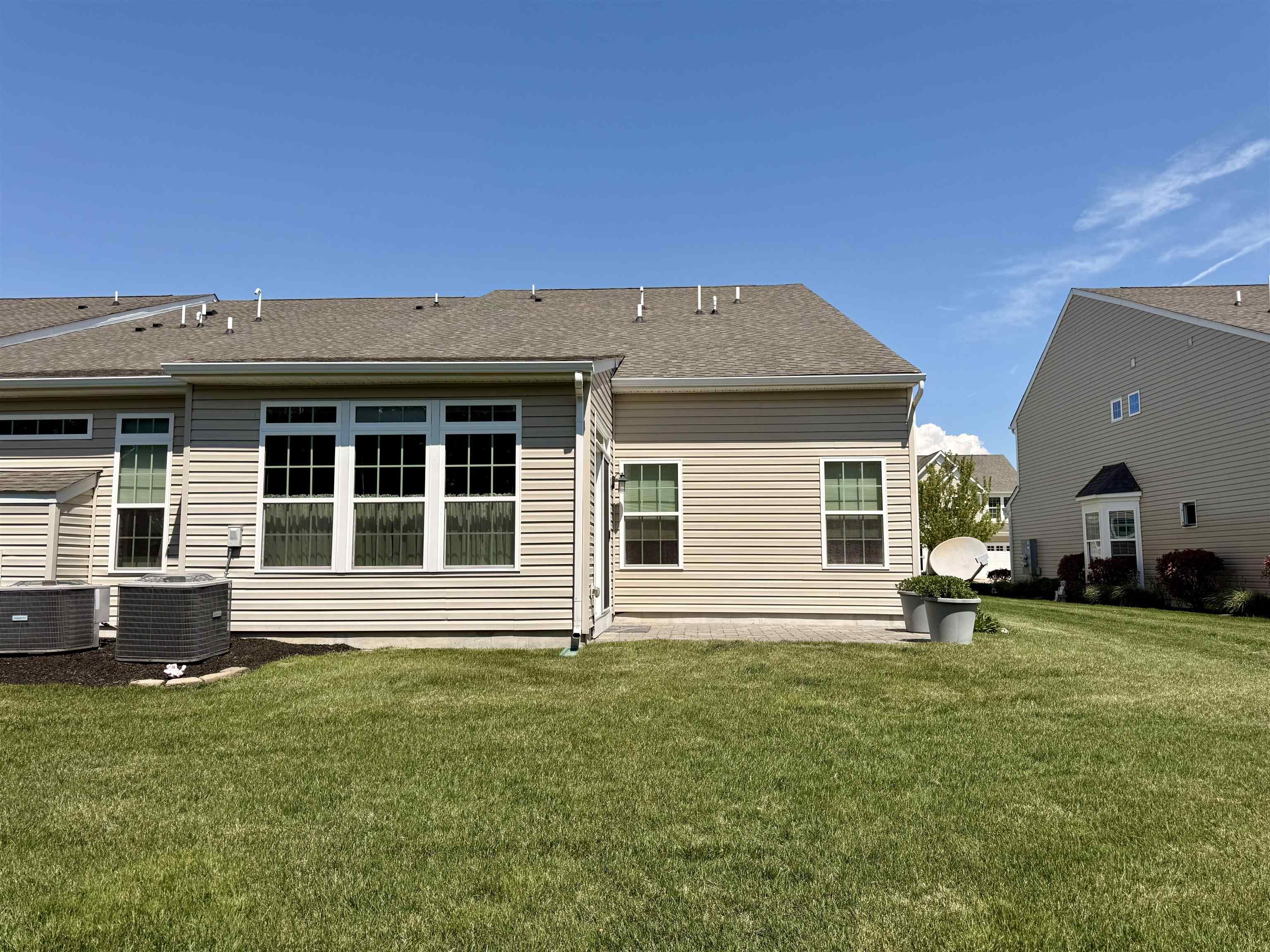 1607 Tidewater Avenue, Unit 1607 Rio Grande, NJ 08242 - Photo 4 of 42 a front view of a house with a yard