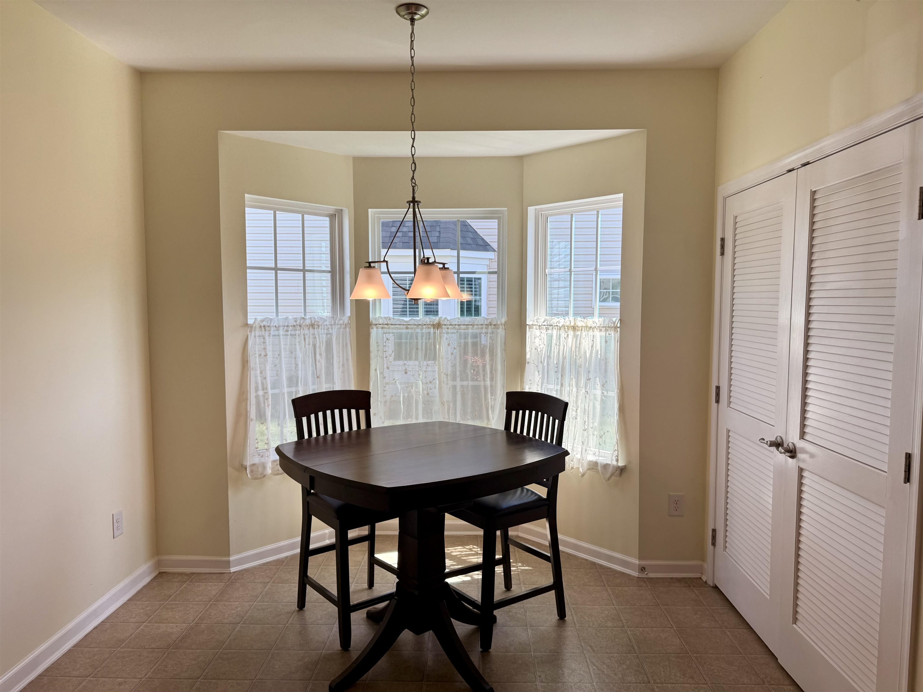 1607 Tidewater Avenue, Unit 1607 Rio Grande, NJ 08242 - Photo 8 of 42 a view of a dining room with a table and chairs