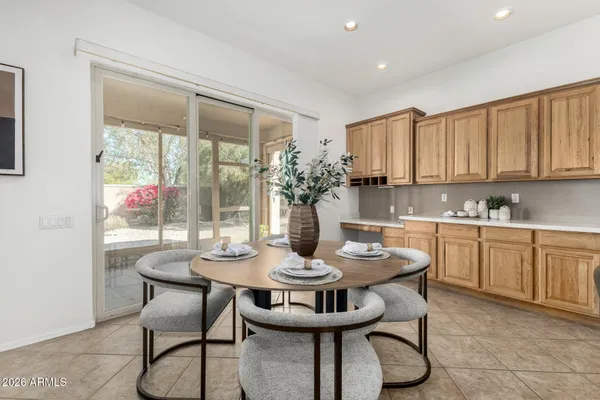 a living room with furniture kitchen view and a fireplace
