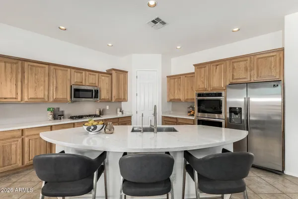 a kitchen with a table and chairs in it