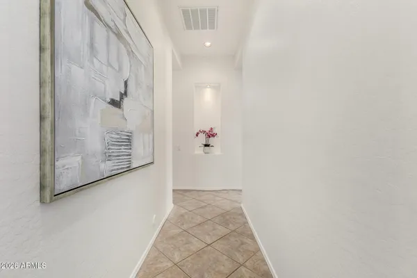 a kitchen with stainless steel appliances a stove a sink a oven a dining table and chairs