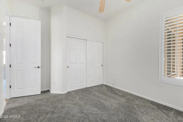 a bathroom with a double vanity sink mirror and toilet