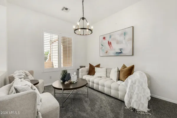 a living room with furniture and a large window