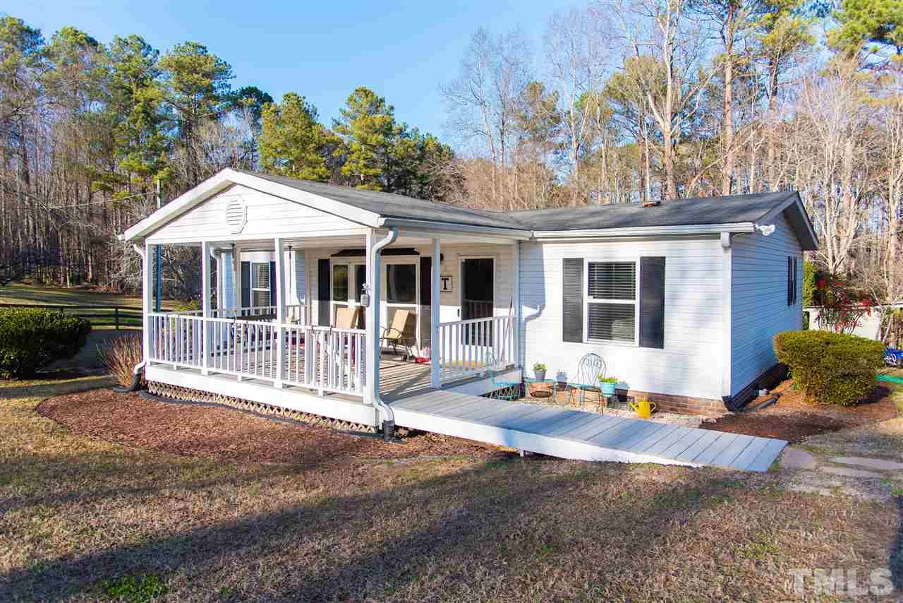 2421 Kearney Road Wake Forest, NC 27587 - Photo 1 of 30 a front view of a house with a patio and a yard