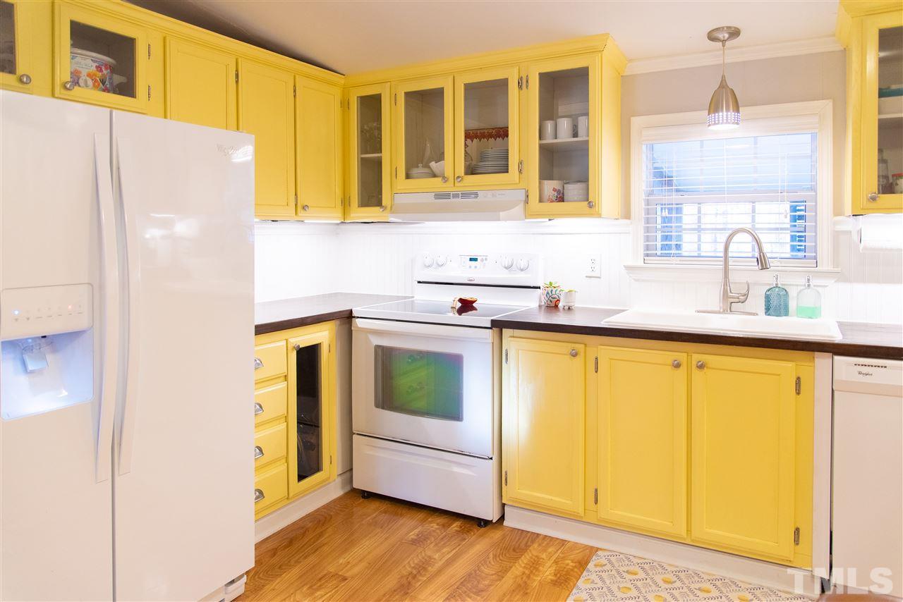 2421 Kearney Road Wake Forest, NC 27587 - Photo 12 of 30 a kitchen with a sink a refrigerator and window