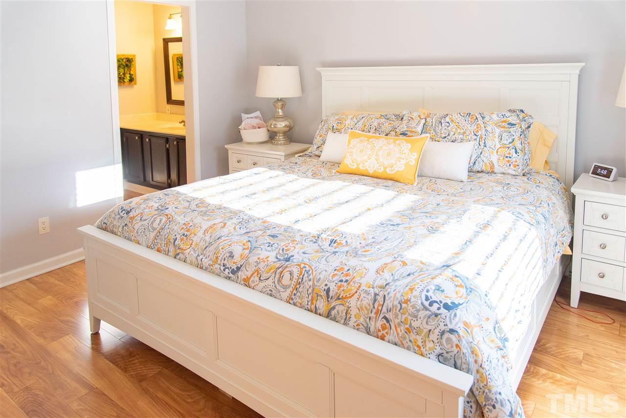 2421 Kearney Road Wake Forest, NC 27587 - Photo 14 of 30 a large bed sitting in a bedroom next to a window